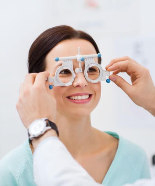 image of woman having her eyes tested by optometrist